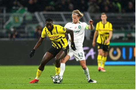 Dortmund ease into last 16 after scoreless draw with Sporting