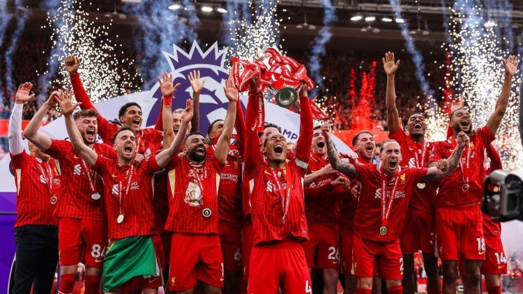 The 2024–25 Premier League trophy is raised by Liverpool in front of a crowded Anfield stadium.
